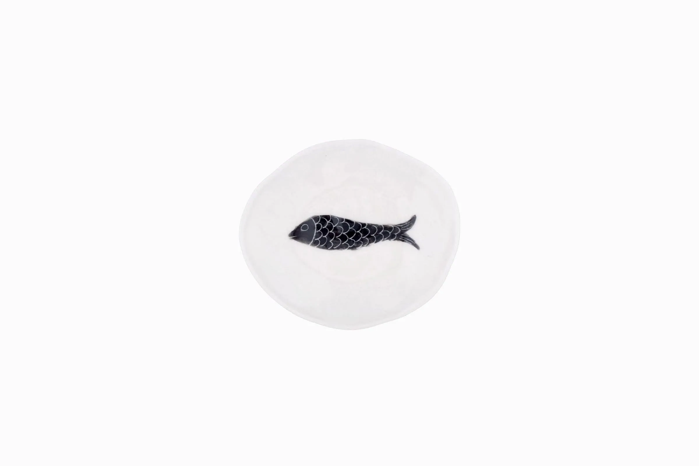 Tiny porcelain dish with black fish